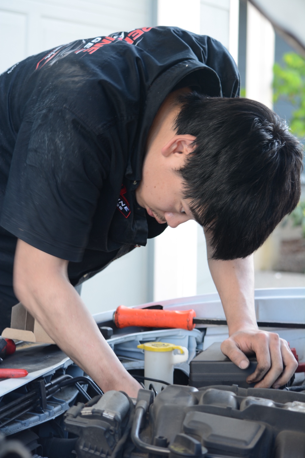 Ryan working under the hood of a customer vehicle